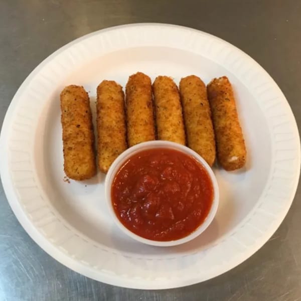 Six golden-brown mozzarella sticks arranged on a white plate with a side of red marinara sauce.